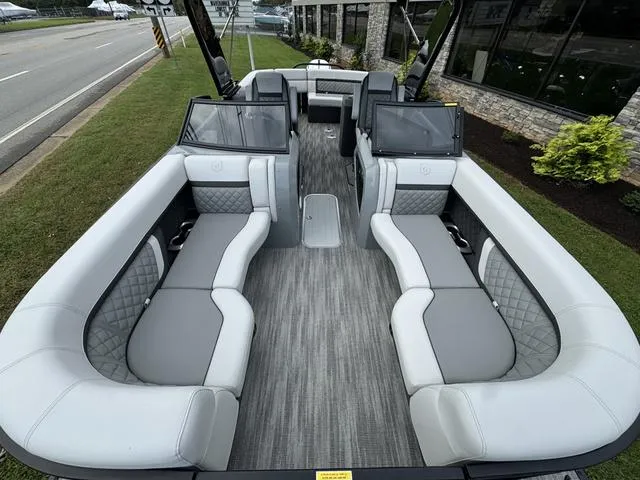 Slide: The Image of Luxurious 2025 Godfrey AP235 ULW pontoon boat with spacious seating and modern design. - 10