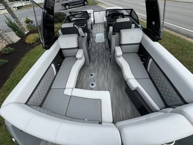 Slide: The Image of 2025 Godfrey AP235 ULW boat interior with luxurious seating and modern design. - 13