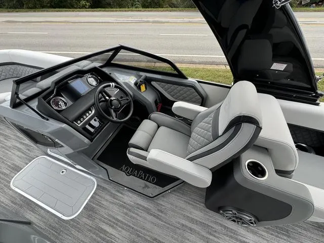 Slide: The Image of Luxurious 2025 Godfrey AP235 ULW boat interior with modern dashboard and comfortable seating. - 16