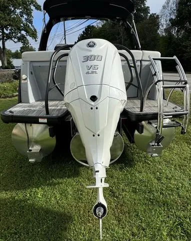 Slide: The Image of 2025 Godfrey AP235 ULW boat with 300 V6 engine, rear view on grass. - 7