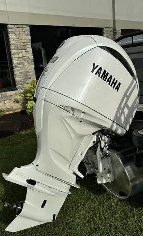 Slide: The Image of White Yamaha outboard motor on a 2025 Godfrey AP235 ULW boat. - 8