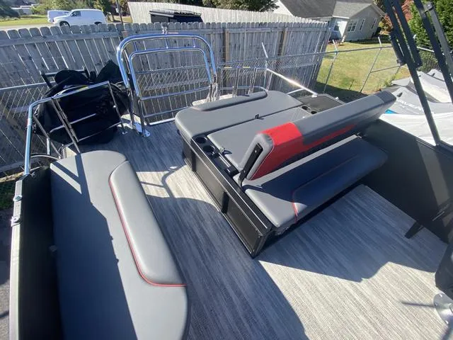 Slide: The Image of 2025 Godfrey SW2286 SFLC boat interior with gray and red seating. - 11
