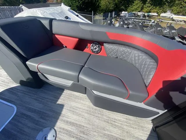Slide: The Image of Luxurious seating on 2025 Godfrey SW2286 SFLC boat with red and gray upholstery. - 12