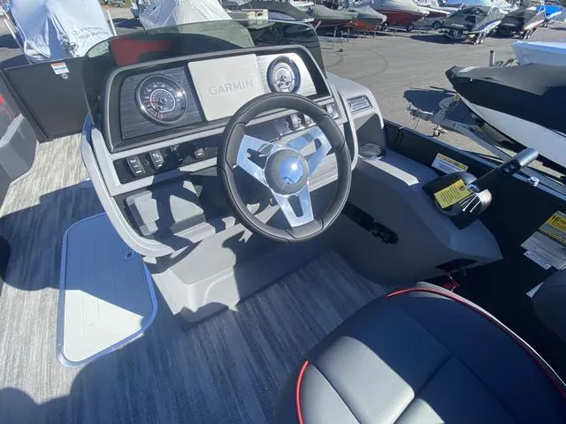 Slide: The Image of 2025 Godfrey SW2286 SFLC boat dashboard with Garmin navigation system. - 3