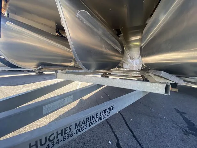 Slide: The Image of Close-up of a 2025 Godfrey SW2286 SFLC pontoon boat on a trailer. - 4