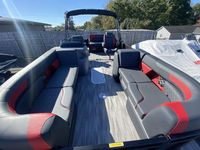 Slide: The Image of 2025 Godfrey SW2286 SFLC pontoon boat with spacious seating and modern design. - 8