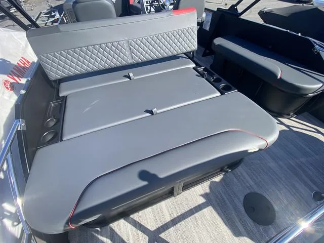 Slide: The Image of 2025 Godfrey SW2286 SFLC boat interior with gray cushioned seating and quilted backrest. - 9