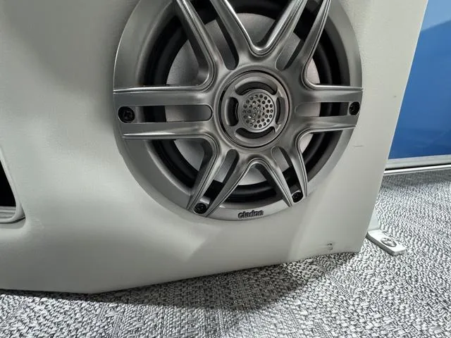 Slide: The Image of Speaker detail on 2025 Godfrey EX2286 SFLX boat, featuring sleek metallic design. - 11