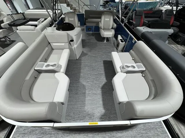 Slide: The Image of 2025 Godfrey EX2286 SFLX pontoon boat interior with spacious seating and modern design. - 5