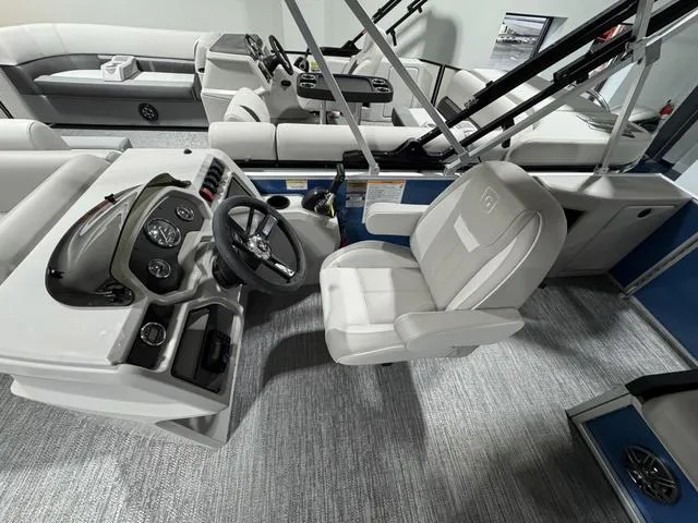 Slide: The Image of 2025 Godfrey EX2286 SFLX boat interior with modern helm and seating. - 8