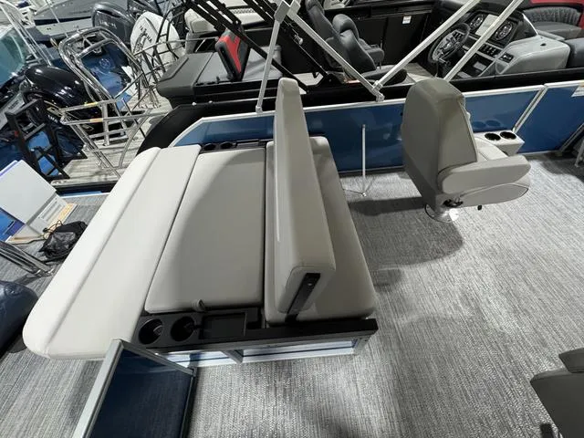 Slide: The Image of 2025 Godfrey EX2286 SFLX boat interior with gray seating and cup holders. - 9
