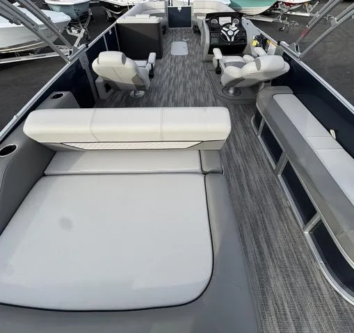 Slide: The Image of 2025 Godfrey MC255SFL pontoon boat interior with plush seating and modern design. - 10