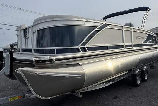 Slide: The Image of 2025 Godfrey MC255SFL pontoon boat on trailer, sleek design, silver finish. - 3
