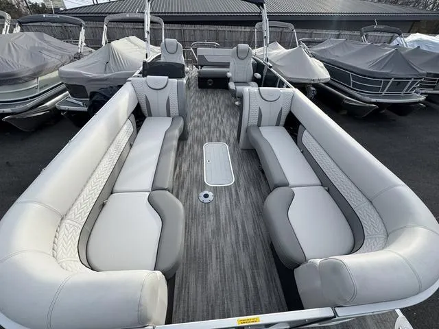 Slide: The Image of Interior of a 2025 Godfrey MC255SFL pontoon boat with gray seating and flooring. - 4