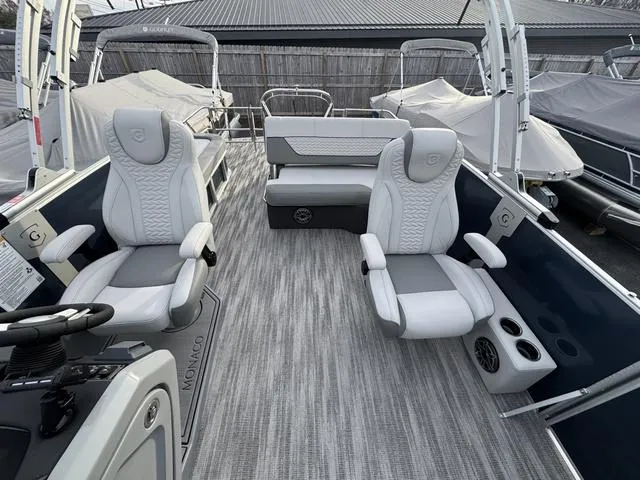 Slide: The Image of 2025 Godfrey MC255SFL boat interior with luxury seating and modern design. - 8