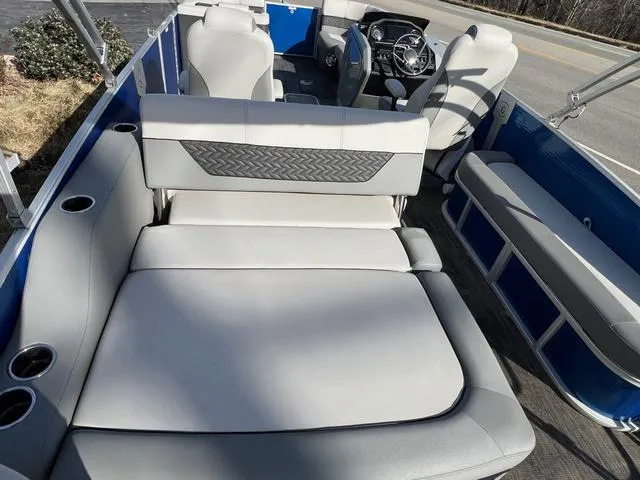 Slide: The Image of 2022 Godfrey Monaco 235 SFL boat interior with plush seating and modern design. - 10