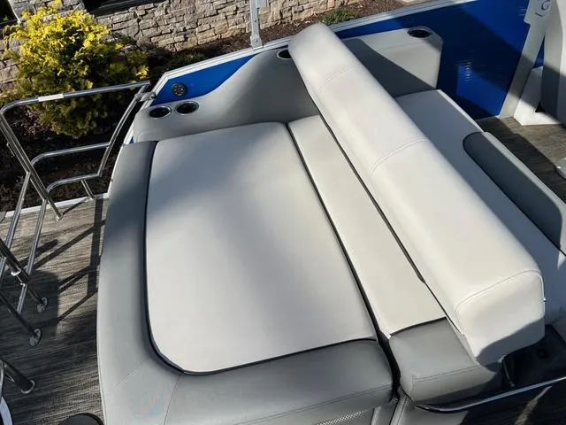 Slide: The Image of 2022 Godfrey Monaco 235 SFL boat with luxurious gray seating and cup holders. - 11