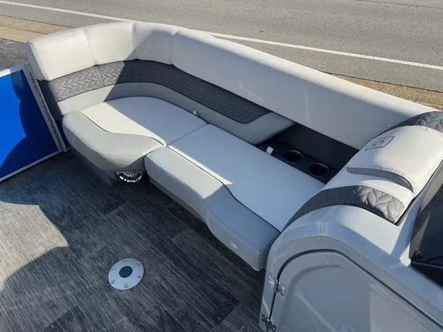 Slide: The Image of 2022 Godfrey Monaco 235 SFL boat interior with gray seating and cup holders. - 18