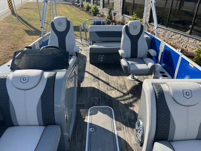 Slide: The Image of 2022 Godfrey Monaco 235 SFL boat interior with luxurious seating and modern design. - 20