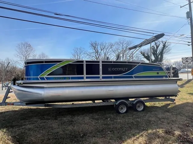 Slide: The Image of 2022 Godfrey Monaco 235 SFL pontoon boat on trailer, parked outdoors. - 5