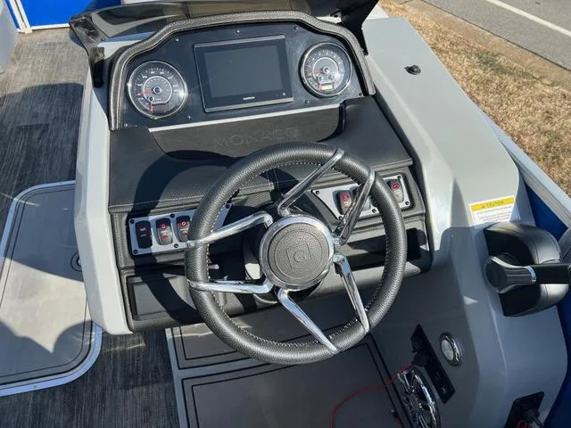 Slide: The Image of 2022 Godfrey Monaco 235 SFL dashboard with steering wheel and control panel. - 7