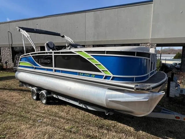 Slide: The Image of 2022 Godfrey Monaco 235 SFL pontoon boat on trailer, blue and green accents. - 8