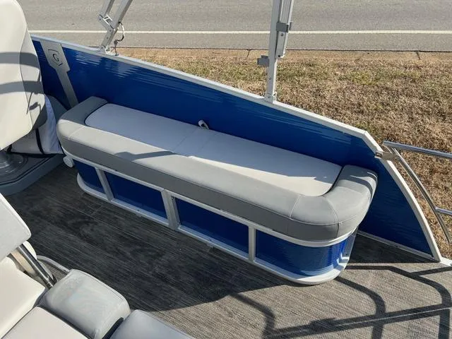 Slide: The Image of 2022 Godfrey Monaco 235 SFL boat interior with blue and gray seating. - 9