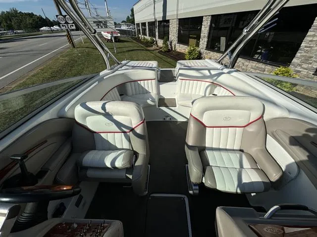 Slide: The Image of Interior of a 2005 Cobalt 262 boat with white and beige seating. - 13
