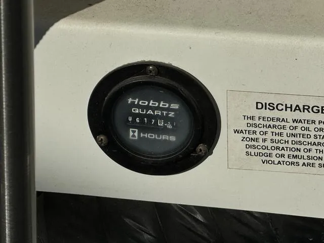 Slide: The Image of Hobbs Quartz hour meter on 2005 Cobalt 262 boat dashboard. - 17