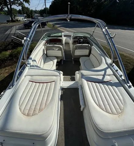 Slide: The Image of 2005 Cobalt 262 boat interior with white seating and sleek design. - 18