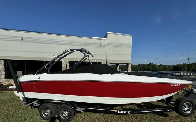 Slide: The Image of 2005 Cobalt 262 boat with red and white exterior on a trailer. - 5