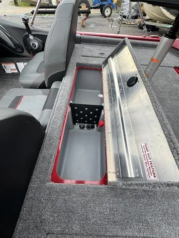 Slide: The Image of 2024 Tracker Pro Team 175 boat interior with open storage compartment. - 10