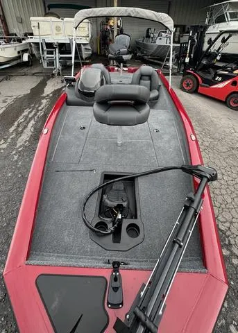Slide: The Image of 2024 Tracker Pro Team 175 boat with red exterior and spacious deck. - 5