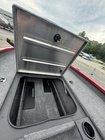 Slide: The Image of 2024 Tracker Pro Team 175 boat storage compartment open, showcasing interior space. - 8