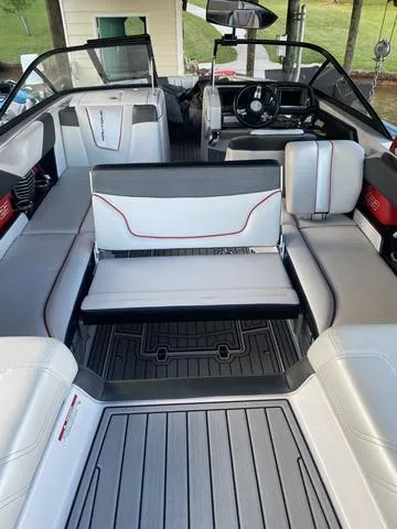 Slide: The Image of 2014 Nautique Super Air G23 boat interior with sleek seating and modern dashboard. - 15