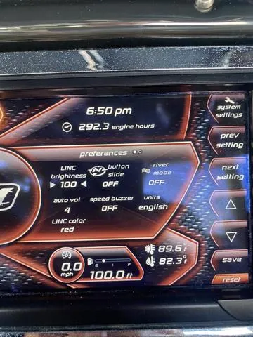 Slide: The Image of Dashboard display of a 2014 Nautique Super Air G23 boat showing settings and engine hours. - 17