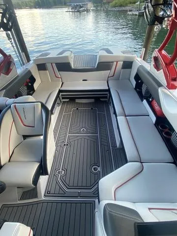 Slide: The Image of 2014 Nautique Super Air G23 boat interior with sleek seating and modern design. - 23