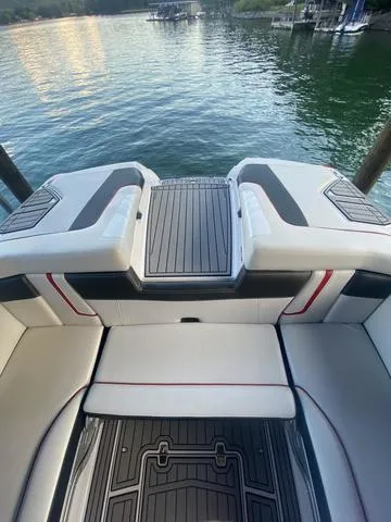Slide: The Image of 2014 Nautique Super Air G23 boat interior with lake view. - 25
