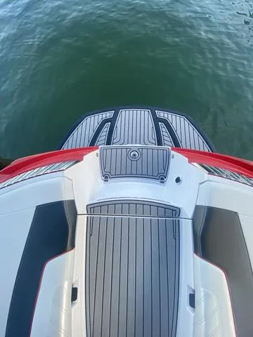 Slide: The Image of 2014 Nautique Super Air G23 boat deck on water. - 26