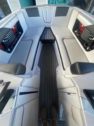 Slide: The Image of Interior of 2014 Nautique Super Air G23 boat with sleek seating and modern design. - 9