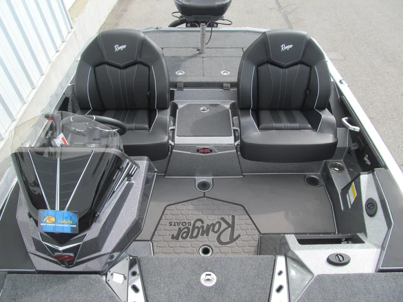 Slide: The Image of 2025 Ranger Z519R Cup-Equipped boat interior with dual black seats and console. - 11