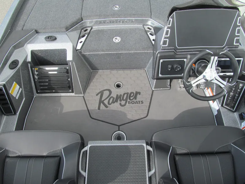 Slide: The Image of 2025 Ranger Z519R Cup-Equipped boat interior with steering wheel and seating. - 12