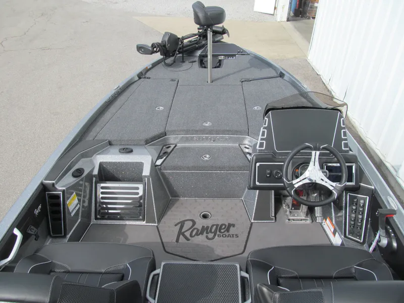 Slide: The Image of 2025 Ranger Z519R Cup-Equipped boat interior with steering console and seating. - 5