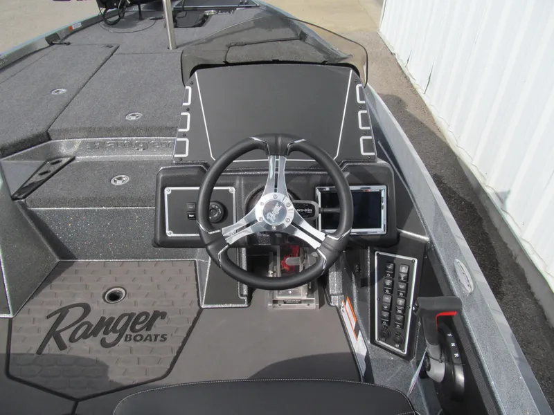 Slide: The Image of 2025 Ranger Z519R Cup-Equipped boat cockpit with steering wheel and control panel. - 6