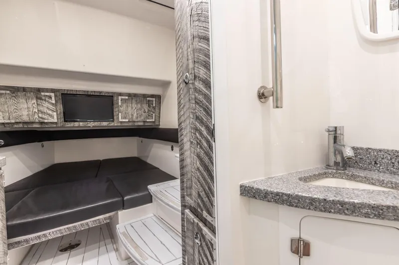 Slide: The Image of 2019 HCB 53 yacht interior with modern cabin and sleek bathroom design. - 14