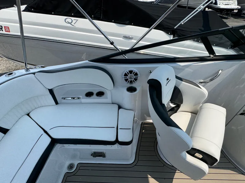 Slide: The Image of Interior of 2025 Stingray 211 DC boat with white seating and modern design. - 4