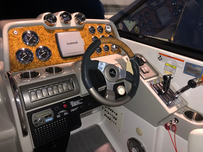 Slide: The Image of 2008 Formula 310 Sun Sport dashboard with Garmin navigation and control instruments. - 10