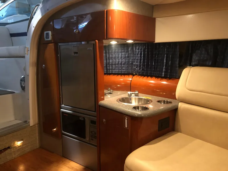 Slide: The Image of Luxurious interior of 2008 Formula 310 Sun Sport boat with kitchenette and seating. - 14