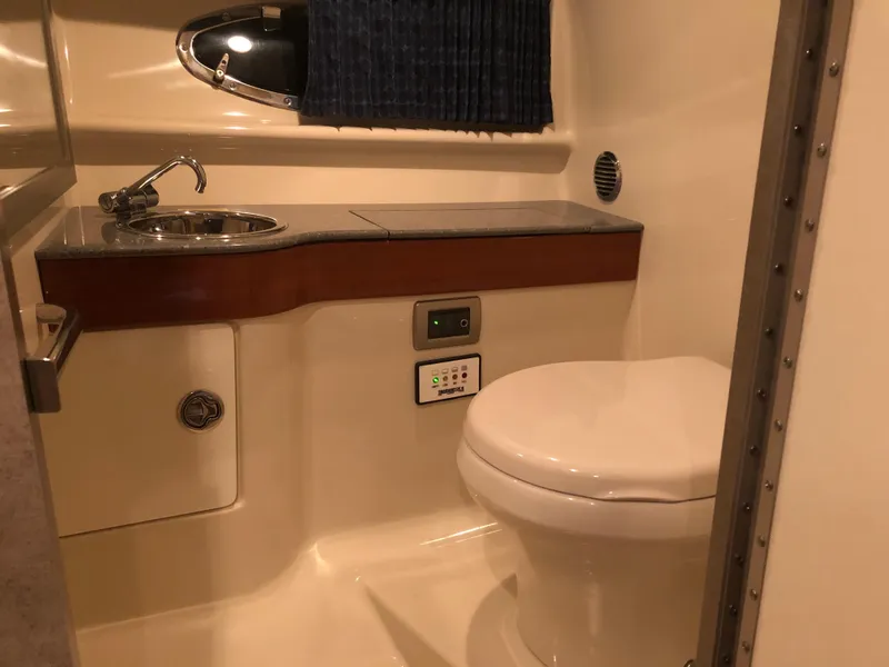 Slide: The Image of 2008 Formula 310 Sun Sport boat bathroom with sink and toilet. - 15