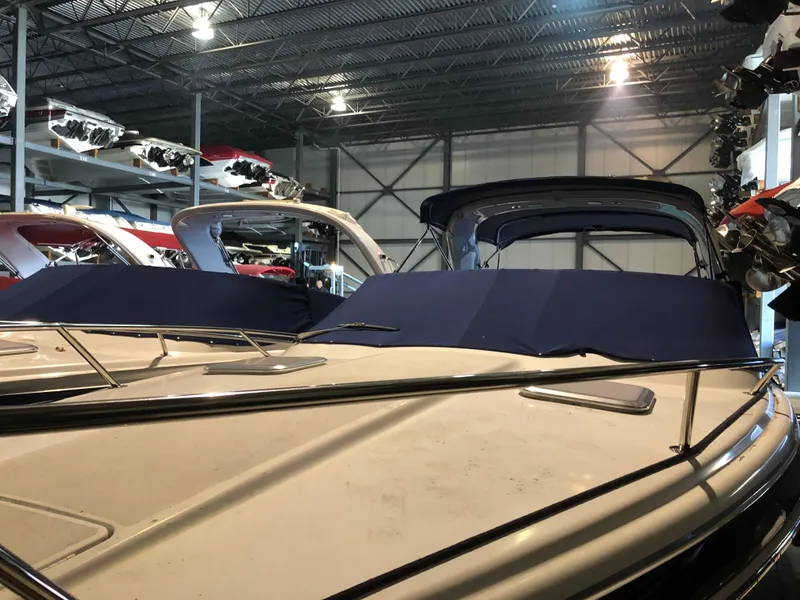 Slide: The Image of 2008 Formula 310 Sun Sport boats in indoor storage facility. - 4